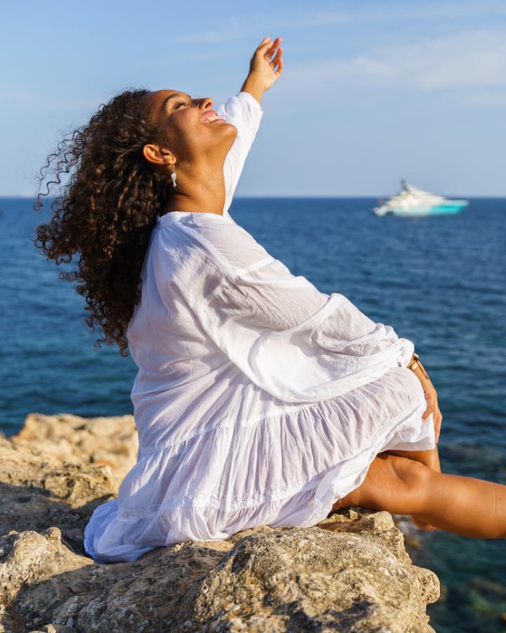 Person at a desk, calm and composed, engaged in focused work